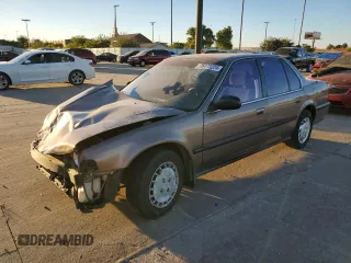 1990 Honda Accord LX with VIN JHMCB7652LC035496, listed as a Copart auction lot 76473224 with 200,671 mi miles and Salvage Title. Bid and sale history available at carsss.com. Image 1.