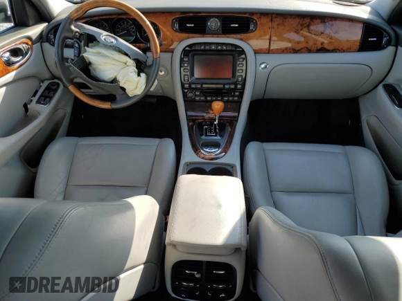 2005 Jaguar XJ with VIN SAJWA79C65SG45989, listed as a Copart auction lot 65357044 with 103,587 mi miles and Salvage Title. Bid and sale history available at carsss.com. Image 8.