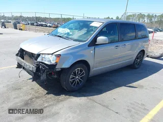 2014 Dodge Grand Caravan SXT with VIN 2C4RDGCGXER261467, listed as a IAAI auction lot 41801810 with 97,322 mi miles and . Bid and sale history available at DreamBid. Image 2.