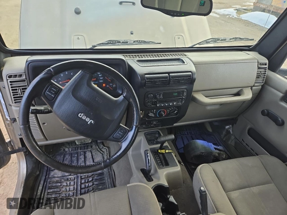 2004 Jeep Wrangler Sahara with VIN 1J4FA59S64P774768, listed as a Copart auction lot 49868895 with 120,800 mi miles and Salvage Title. Bid and sale history available at DreamBid. Image 8.