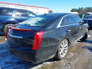 2013 Cadillac XTS Luxury with VIN 2G61P5S33D9101486, listed as a IAAI auction lot 41629349 with 141,050 mi miles. Bid and sale history available at carsss.com. Image 4.