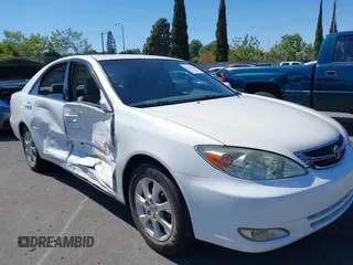 2004 Toyota Camry LE z VIN JTDBE32K940275432, wystawiony jako IAAI lot #42193643 z przebiegiem 172 592 mil mil oraz . Historia ofert i sprzedaży dostępna na DreamBid. Obrazek 1.