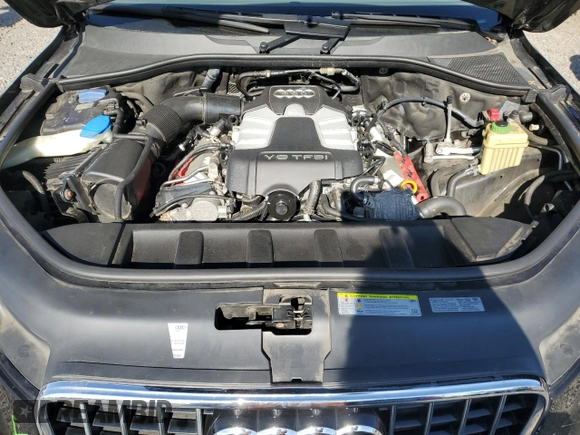 2014 Audi Q7 Premium with VIN WA1CGAFE9ED019934, listed as a Copart auction lot 56388595 with 104,549 mi miles and Salvage title. Bid and sale history available at DreamBid. Image 12.