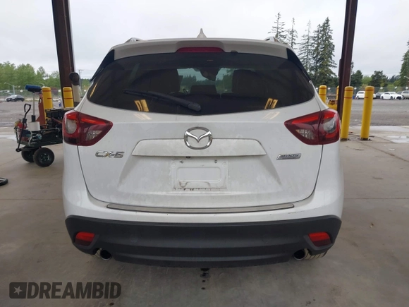 2016 Mazda CX-5 Grand Touring with VIN JM3KE2DYXG0675619, listed as a IAAI auction lot 42137144 with 106,262 mi miles and . Bid and sale history available at DreamBid. Image 16.