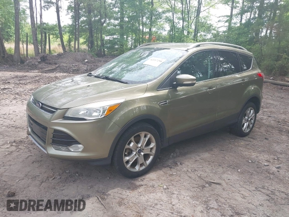 2014 Ford Escape Titanium with VIN 1FMCU9JX9EUB23972, listed as a IAAI auction lot 42217298 with 164,556 mi miles and . Bid and sale history available at DreamBid. Image 2.
