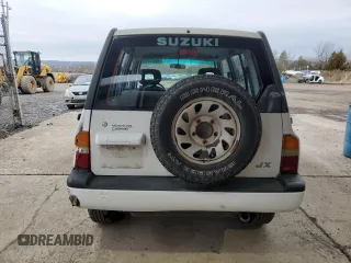 1996 Suzuki Sidekick JX z VIN 2S3TD03V7T6409487, wystawiony jako Copart lot #49977795 z przebiegiem 137 011 mil mil oraz Szkoda całkowita • Salvage title. Historia ofert i sprzedaży dostępna na DreamBid. Obrazek 6.