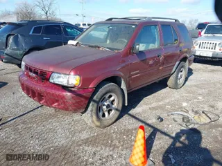 2002 Isuzu Rodeo S with VIN 4S2CK58W824301788, listed as a IAAI auction lot 41216681 with 171,615 mi miles. Bid and sale history available at carsss.com. Image 2.