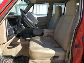 1995 Jeep Cherokee Sport with VIN 1J4FJ68S2SL666126, listed as a Copart auction lot 50496735 with 158,523 mi miles and Salvage title. Bid and sale history available at DreamBid. Image 7.