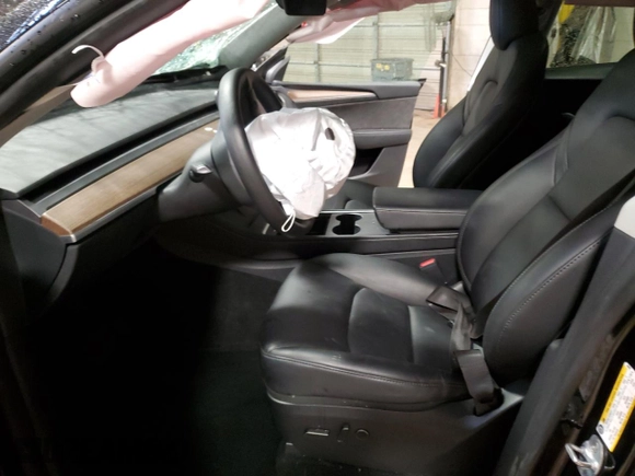 2024 Tesla Model Y с VIN 7SAYGDED0RF084081, выставлен на аукционе Copart как лот 55992195 с пробегом 43 871 миль миль и Списание • Salvage title. История ставок и продаж доступна на DreamBid. Изображение 7.