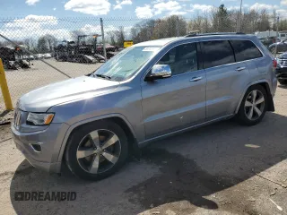 2015 Jeep Grand Cherokee Overland with VIN 1C4RJFCM3FC761831, listed as a Copart auction lot 51776185 with Not provided miles and Salvage title. Bid and sale history available at DreamBid. Image 1.