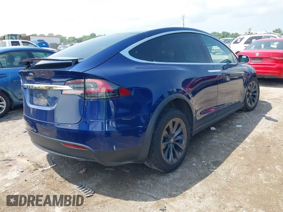 2018 Tesla Model X 75D with VIN 5YJXCAE21JF132628, listed as a IAAI auction lot 42081282 with 35,360 mi miles and . Bid and sale history available at carsss.com. Image 4.