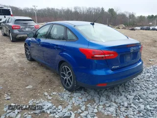 2018 Ford Focus SE z VIN 1FADP3F25JL255840, wystawiony jako IAAI lot #41852913 z przebiegiem 64 010 mil mil oraz . Historia ofert i sprzedaży dostępna na DreamBid. Obrazek 3.