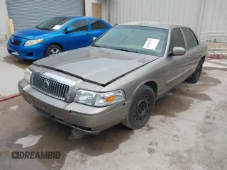 2006 Mercury Grand Marquis GS z VIN 2MEFM74VX6X655255, wystawiony jako IAAI lot #42261870 z przebiegiem Nie podano mil oraz . Historia ofert i sprzedaży dostępna na DreamBid. Obrazek 2.