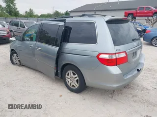 2005 Honda Odyssey EX-L z VIN 5FNRL38775B117598, wystawiony jako IAAI lot #42276239 z przebiegiem 184 134 mil mil oraz . Historia ofert i sprzedaży dostępna na DreamBid. Obrazek 3.