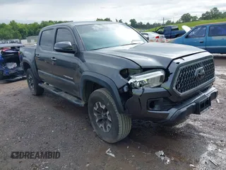 2018 Toyota Tacoma SR with VIN 3TMCZ5AN1JM178654, listed as a IAAI auction lot 42322167 with 116,980 mi miles and . Bid and sale history available at DreamBid. Image 1.