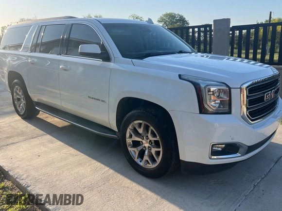 2016 GMC Yukon XL SLE with VIN 1GKS1FKC4GR126775, listed as a Copart auction lot 52828325 with 110,002 mi miles and Clean Title. Bid and sale history available at carsss.com. Image 1.