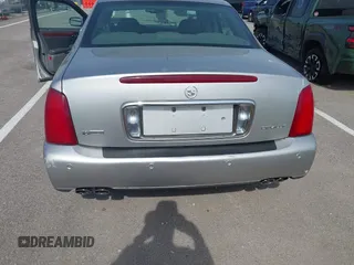 2005 Cadillac DeVille z VIN 1G6KD54Y65U192442, wystawiony jako IAAI lot #42257163 z przebiegiem 100 381 mil mil oraz . Historia ofert i sprzedaży dostępna na DreamBid. Obrazek 6.