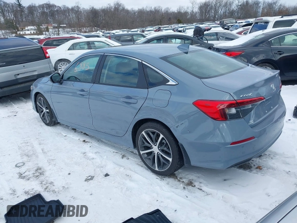 2024 Honda Civic Sedan Touring with VIN 2HGFE1F9XRH338023, listed as a IAAI auction lot 41256885 with 3,210 mi miles. Bid and sale history available at carsss.com. Image 3.