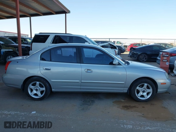 2003 Hyundai Elantra GLS z VIN KMHDN45D43U552485, wystawiony jako IAAI lot #41680449 z przebiegiem 127 899 mil mil oraz . Historia ofert i sprzedaży dostępna na DreamBid. Obrazek 13.