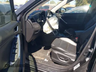 2014 Mazda CX-5 Grand Touring with VIN JM3KE4DY8E0391317, listed as a IAAI auction lot 41871641 with 77,048 mi miles. Bid and sale history available at carsss.com. Image 5.