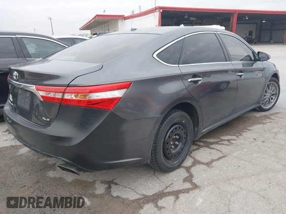 2015 Toyota Avalon Limited with VIN 4T1BK1EB1FU141126, listed as a IAAI auction lot 41433775 with 142,915 mi miles and . Bid and sale history available at DreamBid. Image 4.