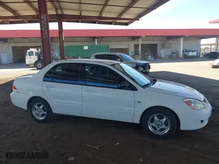 2004 Mitsubishi Lancer ES with VIN JA3AJ26E14U065498, listed as a IAAI auction lot 41887945 with 142,632 mi miles. Bid and sale history available at carsss.com. Image 13.