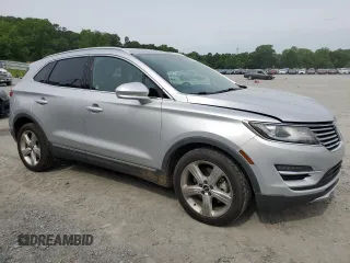 2017 Lincoln MKC Premiere with VIN 5LMCJ1C91HUL32617, listed as a Copart auction lot 57444215 with 106,285 mi miles and Salvage title. Bid and sale history available at DreamBid. Image 4.
