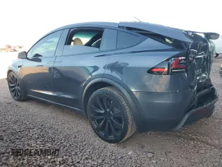 2023 Tesla Model X with VIN 7SAXCAE5XPF384061, listed as a Copart auction lot 86834084 with 6,974 mi miles and Salvage Title. Bid and sale history available at DreamBid. Image 2.