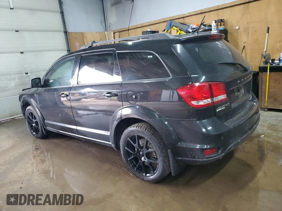 2013 Dodge Journey Crew with VIN 3C4PDCCG4DT693869, listed as a Copart auction lot 63666684 with 134,424 mi miles and Salvage title. Bid and sale history available at DreamBid. Image 2.