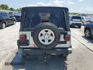 2004 Jeep Wrangler X with VIN 1J4FA39S74P763492, listed as a Copart auction lot 54664095 with 168,493 mi miles and Salvage Title. Bid and sale history available at DreamBid. Image 6.