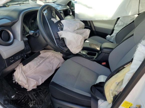 2018 Toyota RAV4 XLE with VIN 2T3RFREV1JW812970, listed as a Copart auction lot 51656915 with 77,892 mi miles and Salvage Title. Bid and sale history available at DreamBid. Image 7.