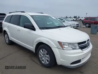 2014 Dodge Journey SE with VIN 3C4PDCAB5ET311051, listed as a IAAI auction lot 38469803 with 216,481 mi miles. Bid and sale history available at carsss.com. Image 1.