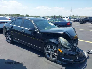 2014 Mercedes-Benz C 250 Sport with VIN WDDGF4HB1ER306501, listed as a IAAI auction lot 42261939 with 69,729 mi miles and . Bid and sale history available at DreamBid. Image 1.