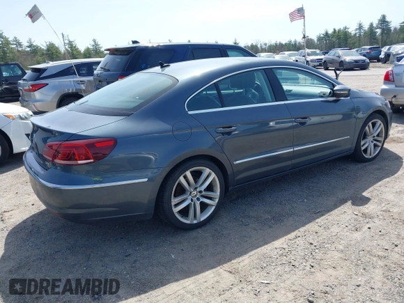 2014 Volkswagen CC Lux with VIN WVWRP7AN7EE501483, listed as a IAAI auction lot 42090985 with 121,737 mi miles. Bid and sale history available at carsss.com. Image 4.