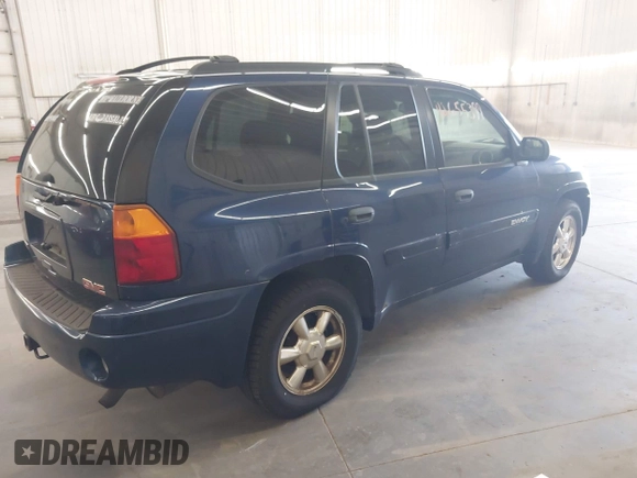 2003 GMC Envoy SLE with VIN 1GKDT13SX32365522, listed as a IAAI auction lot 42655399 with 210,765 mi miles and . Bid and sale history available at DreamBid. Image 4.