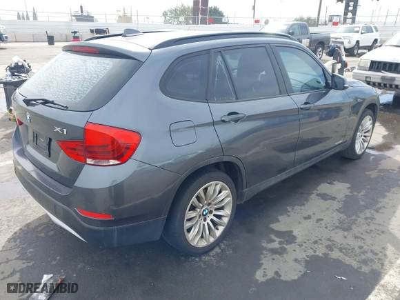 2013 BMW X1 28i with VIN WBAVM1C55DVW41609, listed as a IAAI auction lot 41604038 with 126,036 mi miles. Bid and sale history available at carsss.com. Image 4.