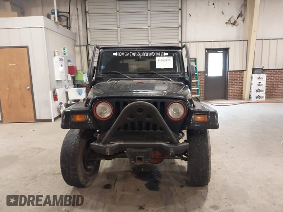 1999 Jeep Wrangler Sahara z VIN 1J4FY49S4XP432567, wystawiony jako IAAI lot #41562455 z przebiegiem Nie podano mil oraz . Historia ofert i sprzedaży dostępna na DreamBid. Obrazek 12.