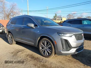 2022 Cadillac XT6 Premium Luxury z VIN 1GYKPDRS0NZ106672, wystawiony jako IAAI lot #41883167 z przebiegiem 104 209 mil mil oraz . Historia ofert i sprzedaży dostępna na DreamBid. Obrazek 1.