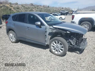 2015 Mazda CX-5 Grand Touring with VIN JM3KE4DY5F0540655, listed as a Copart auction lot 52893155 with 152,279 mi miles and Salvage Title. Bid and sale history available at carsss.com. Image 4.
