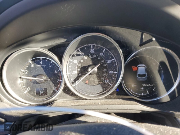 2018 Mazda CX-5 Grand Touring z VIN JM3KFBDM6J0337006, wystawiony jako Copart lot #87155694 z przebiegiem 50 643 mil mil oraz Szkoda całkowita • Salvage title. Historia ofert i sprzedaży dostępna na DreamBid. Obrazek 9.