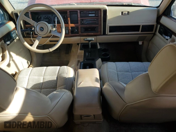 1993 Jeep Cherokee z VIN 1J4FT78S9PL634409, wystawiony jako Copart lot #77034984 z przebiegiem 146 585 mil mil oraz Szkoda całkowita • Salvage title. Historia ofert i sprzedaży dostępna na DreamBid. Obrazek 8.