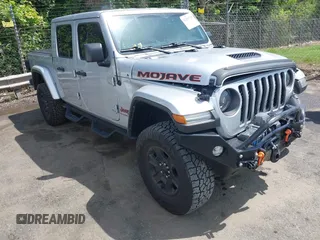 2023 Jeep Gladiator Mojave z VIN 1C6JJTEGXPL548712, wystawiony jako IAAI lot #42259719 z przebiegiem 15 535 mil mil oraz . Historia ofert i sprzedaży dostępna na DreamBid. Obrazek 1.
