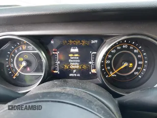 2023 Jeep Gladiator Sport S z VIN 1C6HJTAG7PL567903, wystawiony jako IAAI lot #41574387 z przebiegiem 49 378 mil mil oraz . Historia ofert i sprzedaży dostępna na DreamBid. Obrazek 7.