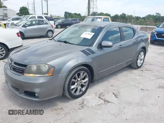 2013 Dodge Avenger R/T with VIN 1C3CDZBG4DN590183, listed as a IAAI auction lot 42178040 with 150,265 mi miles and . Bid and sale history available at carsss.com. Image 2.