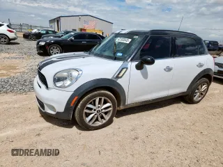 2014 MINI Countryman S with VIN WMWZC3C54EWP27778, listed as a Copart auction lot 62303045 with 128,556 mi miles and Salvage title. Bid and sale history available at DreamBid. Image 1.
