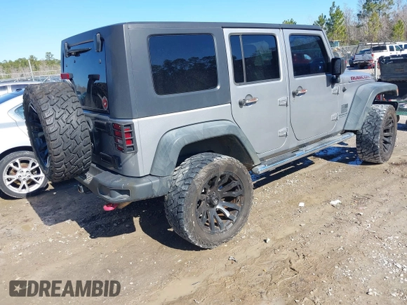 2015 Jeep Wrangler Unlimited Rubicon Hard Rock with VIN 1C4HJWFG2FL587607, listed as a IAAI auction lot 41419237 with 109,719 mi miles and . Bid and sale history available at DreamBid. Image 4.