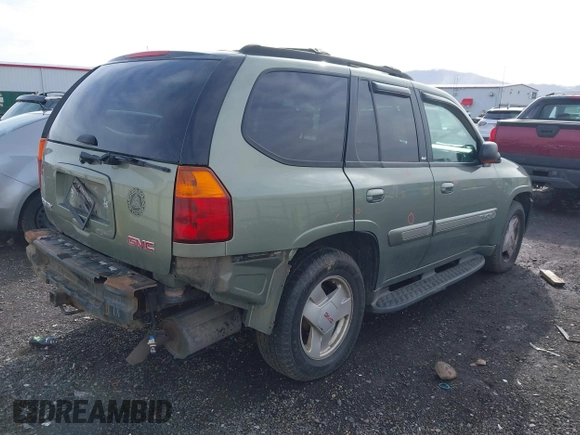 2003 GMC Envoy SLT with VIN 1GKDT13SX32161898, listed as a IAAI auction lot 41642072 with 230,154 mi miles. Bid and sale history available at carsss.com. Image 4.