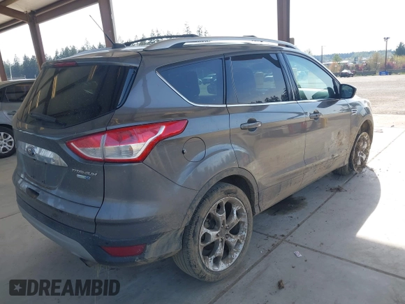 2014 Ford Escape Titanium with VIN 1FMCU9JX0EUC45801, listed as a IAAI auction lot 42121561 with 80,217 mi miles and . Bid and sale history available at DreamBid. Image 4.