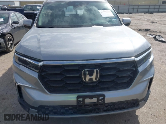 2025 Honda Pilot EX-L z VIN 5FNYG2H46SB013504, wystawiony jako IAAI lot #41777928 z przebiegiem 5 163 mil mil oraz . Historia ofert i sprzedaży dostępna na DreamBid. Obrazek 13.