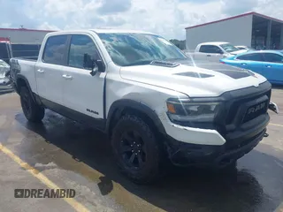 2021 Ram 1500 Rebel with VIN 1C6SRFLTXMN570577, listed as a IAAI auction lot 42167696 with 114,164 mi miles and . Bid and sale history available at DreamBid. Image 1.